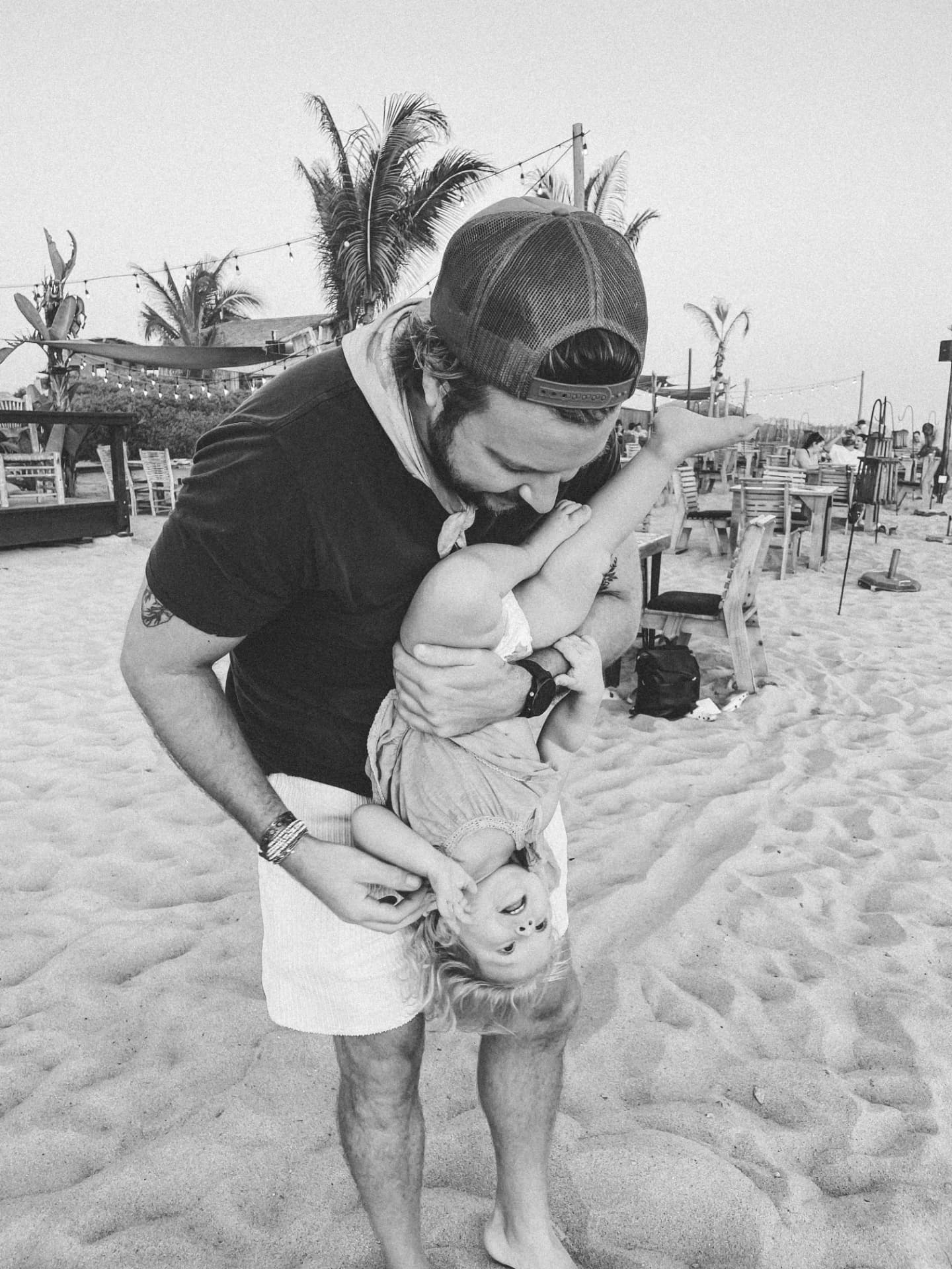 Ryan playing with his daughter on the beach